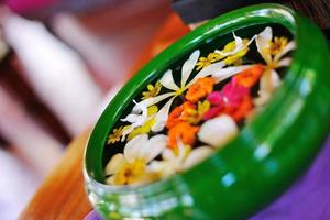 water cup with beautiful flowers background photo