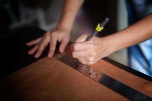 Close-up of a hardworking professional  . Concept workshop . craft photo