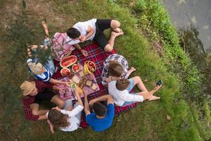 top view of group friends enjoying picnic time photo