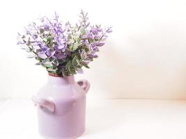 Picture of artificial plastic flower on a ceramic vase photo