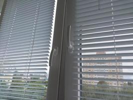 Horizontal aluminum blinds installed on the balcony