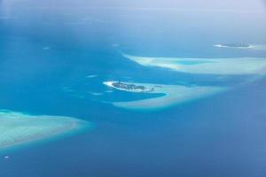 Aerial view of Maldives atolls is the world top beauty. Maldives tourism. Amazing aerial of the beautiful atolls of the Maldives. photo