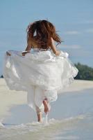 asian bride on beach photo