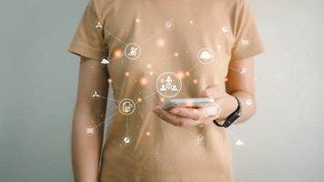Concept global data connection with internet technology, user using smartphone for online transactions by internet technology, big data, database management, cloud computing, cashless society. photo