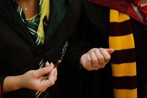 Hands holding a test tube with a potion. photo