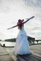 asian bride on beach photo