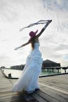 asian bride on beach photo