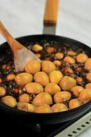 Close Up Semur Telur Puyuh  is Boiled Eggs Cook with Soy Sauce for Family Menu photo