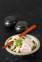 Japanese Kake Udon with Narutomaki and Green Onion photo