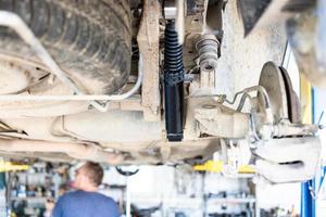 bottom view of car with replaced rshock absorber photo