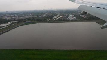 Airplane approaching before landing during the rain video