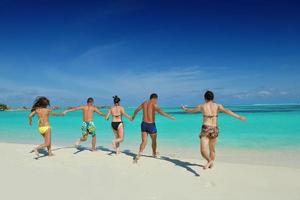 group of happy young people have fun on bach photo