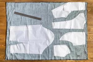 top view of paper layout of pattern on gray fabric photo