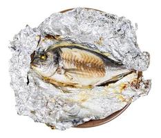 gilt-head sea bream fish baked in foil isolated photo