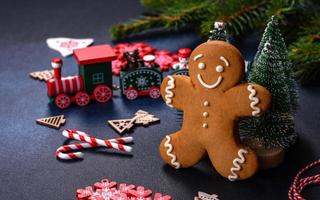 Christmas homemade gingerbread cookies on a dark concrete table table photo
