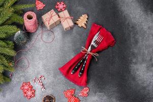 Gingerbread, Christmas tree decorations, dried citrus fruits on a gray concrete background photo