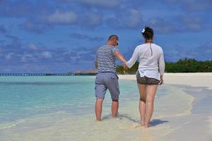 happy young  couple at summer vacation have fun and relax at beach photo