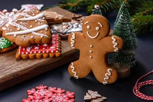 Christmas homemade gingerbread cookies on a dark concrete table table photo