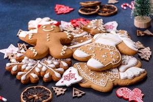 Christmas homemade gingerbread cookies on dark concrete table photo