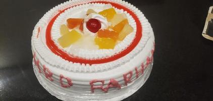 Closeup of cake in refrigerated storage and display unit in a Indian Bakery photo