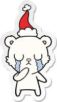 caricatura de pegatina de oso polar llorando de un sombrero de santa vector