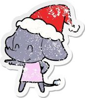 cute distressed sticker cartoon of a elephant wearing santa hat vector