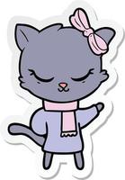 sticker of a cute cartoon cat with bow vector