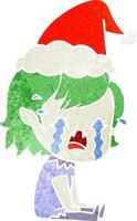 retro cartoon of a crying vampire girl wearing santa hat vector