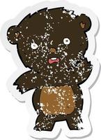 retro distressed sticker of a cartoon waving black bear cub vector