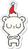 peaceful sticker cartoon of a polar bear wearing santa hat vector