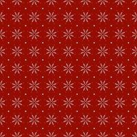 White flower and snowflake on red background photo