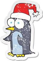 retro distressed sticker of a cartoon christmas penguin vector