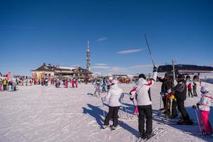 group of happy people having fun on snow photo