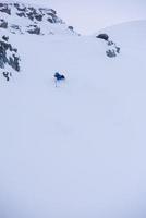 freeride skier skiing downhill photo