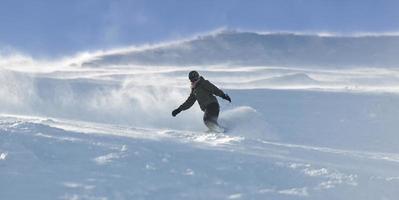 freestyle snowboarder jump and ride photo