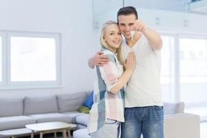 couple showing a keys of their new house photo