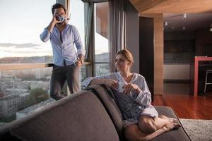 young couple enjoying evening coffee by the window photo