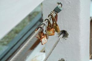 Square rust lock iron with iron chain and blurred background. photo