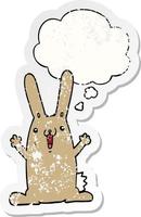 cartoon rabbit and thought bubble as a distressed worn sticker vector