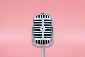 Retro microphone with copy space on pink background photo