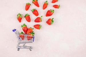 Shopping concept composition with strawberries photo