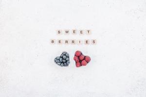 Valentine Day composition berries in heart plates photo