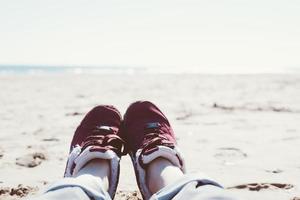 Girl relaxing on sand beach photo