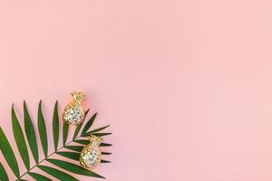 Creative pink background with tropical palm leaves photo