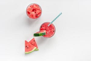 Watermelon smoothie with crushed fruits in glasses photo