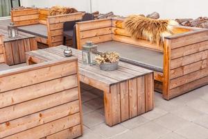 Outdoor restaurant terrace with wooden furniture photo