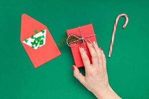 Christmas greeting card with woman hand photo