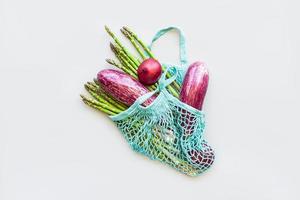 Fresh organic vegetables cotton mesh shopping bag photo