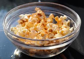 Close up on spiced popcorn in a glas bowl. photo