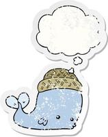 cartoon whale wearing hat and thought bubble as a distressed worn sticker vector